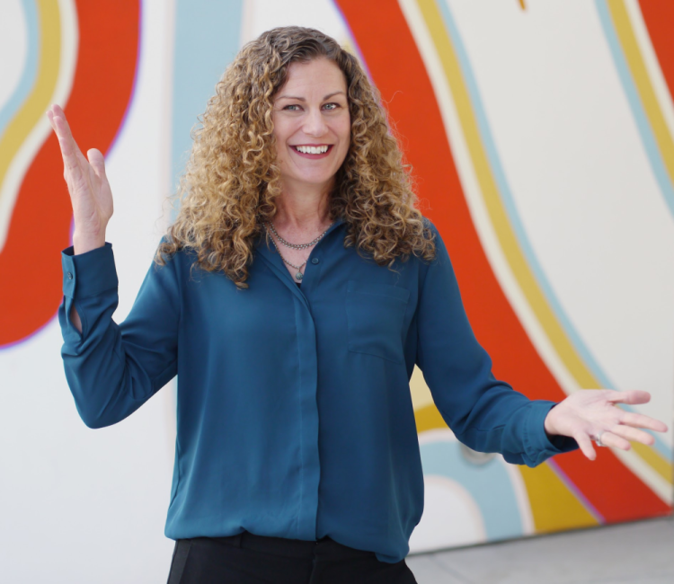 Dalena Bradley how to bring energy to job interviews gesture orange stripes