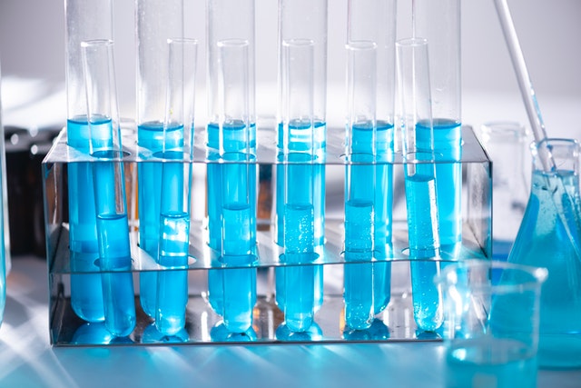 Blue liquid laboratory test tubes job interview formula for success